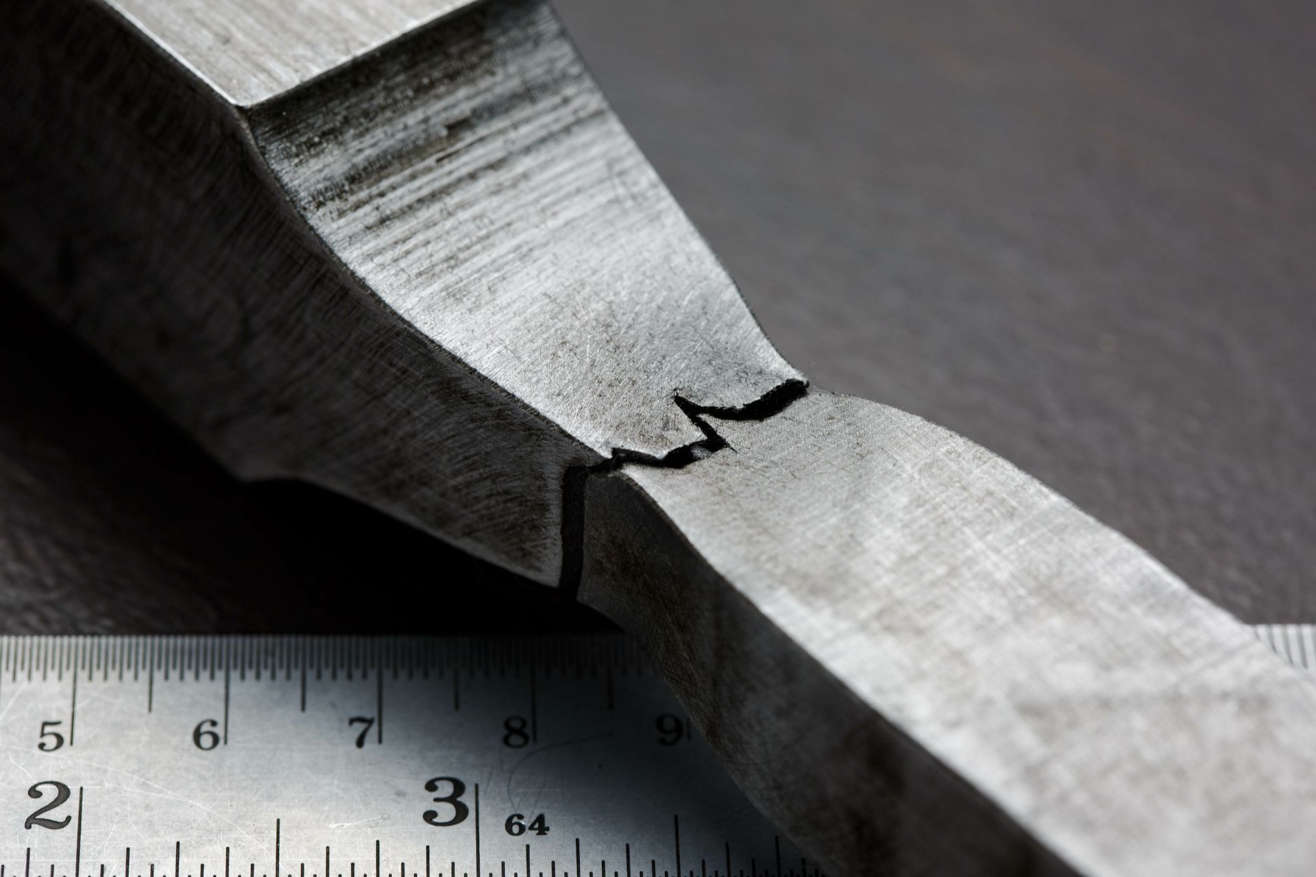 A piece of metal is being measured by a ruler