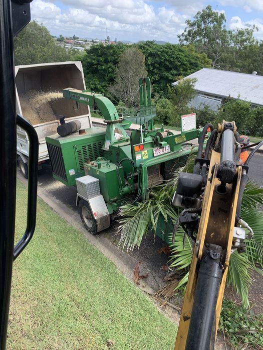 Cut Tree Branches in Wood Chipper — Gympie, QLD — Smith Tree Solutions