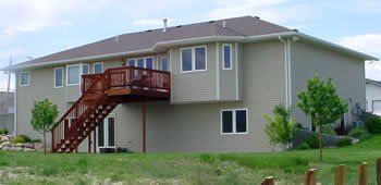 New House with Steel Ladder — Casper, WY — DDD Exteriors Inc