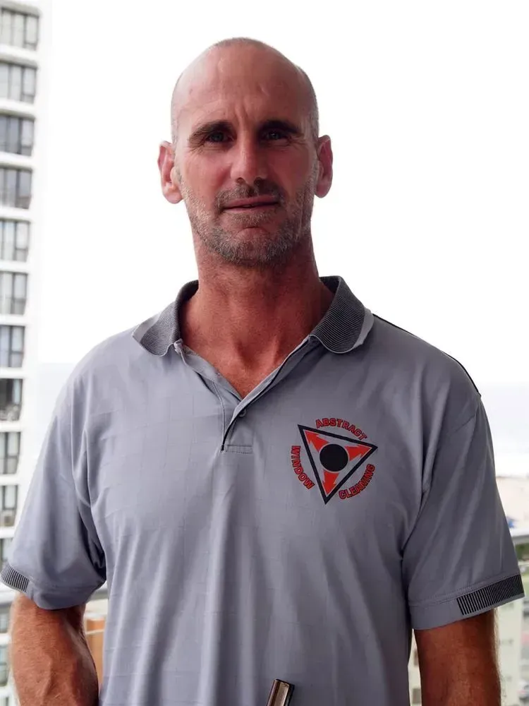 Man Wearing a Grey Shirt With a Triangle on It — Abstract Window Cleaning in Hopkins Creek, NSW