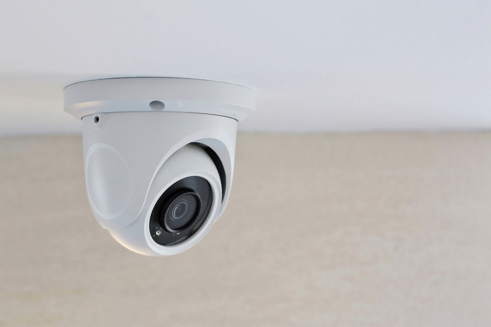 White Security Camera Mounted on a White Ceiling — Shaine Hunter Locksmiths in Doomadgee, QLD