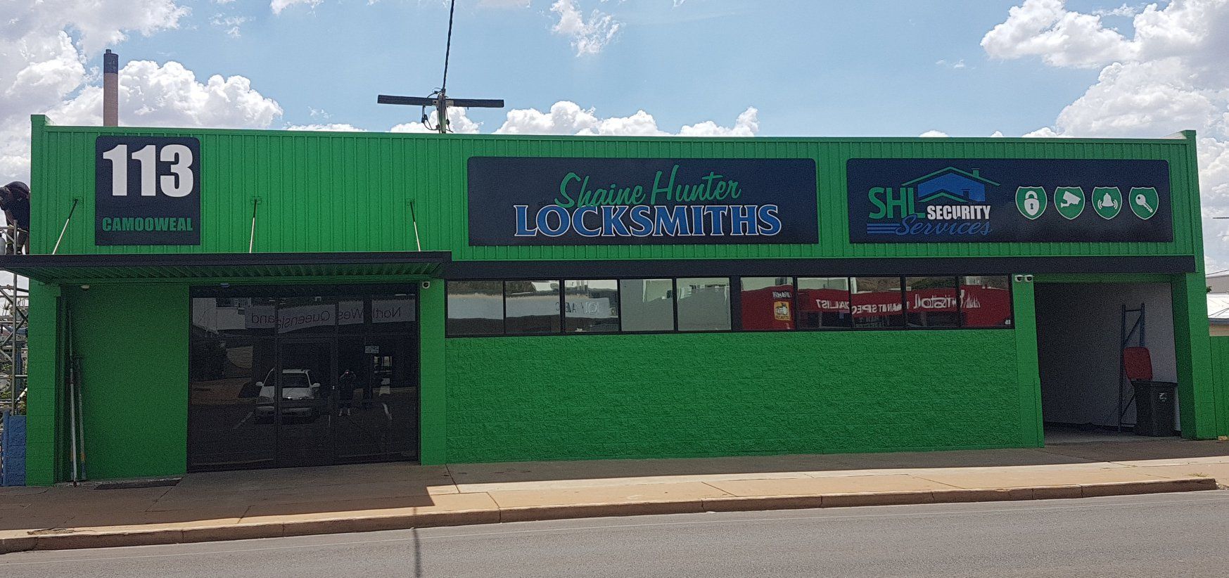 Shaine Hunter Locksmiths Storefront With Employees — Shaine Hunter Locksmiths in Mount Isa City, QLD