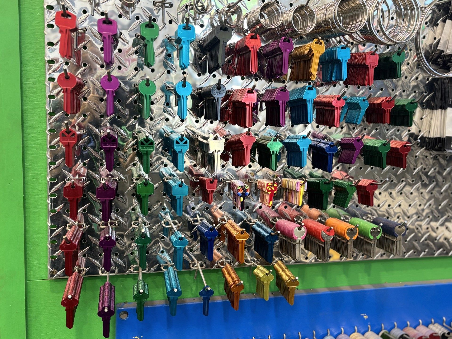 Keys of Many Colors Hanging on a Pegboard — Shaine Hunter Locksmiths in Cloncurry, QLD