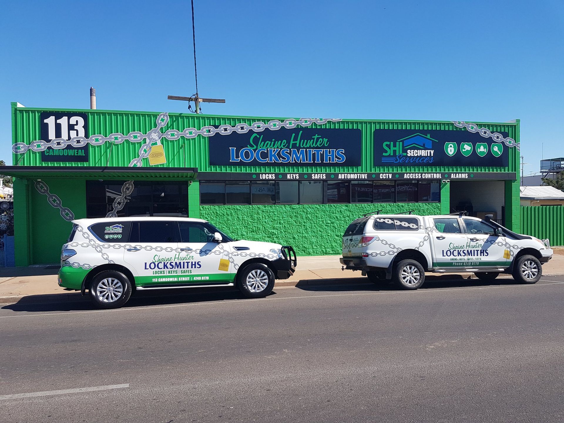 Two White and Green Branded Vehicles — Shaine Hunter Locksmiths in Cloncurry, QLD