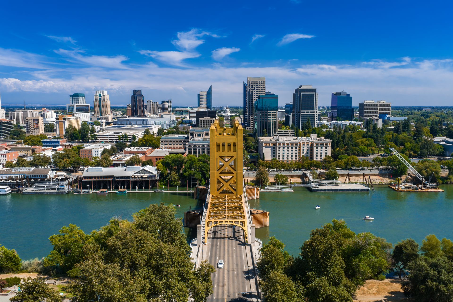Aerial view of Sacramento, California skyline with Tower Bridge crossing the river.