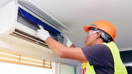 Technician Repairing Air Condition — Home Comfort Systems in Bolingbrook, IL