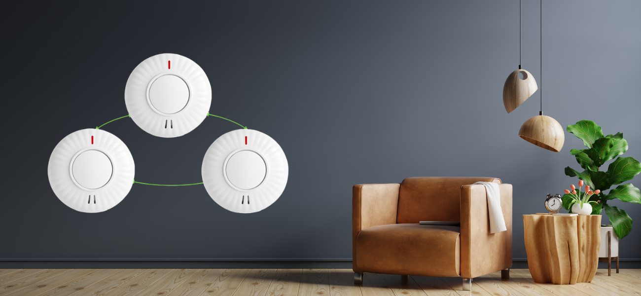 interlinking smoke alarms on a wall
