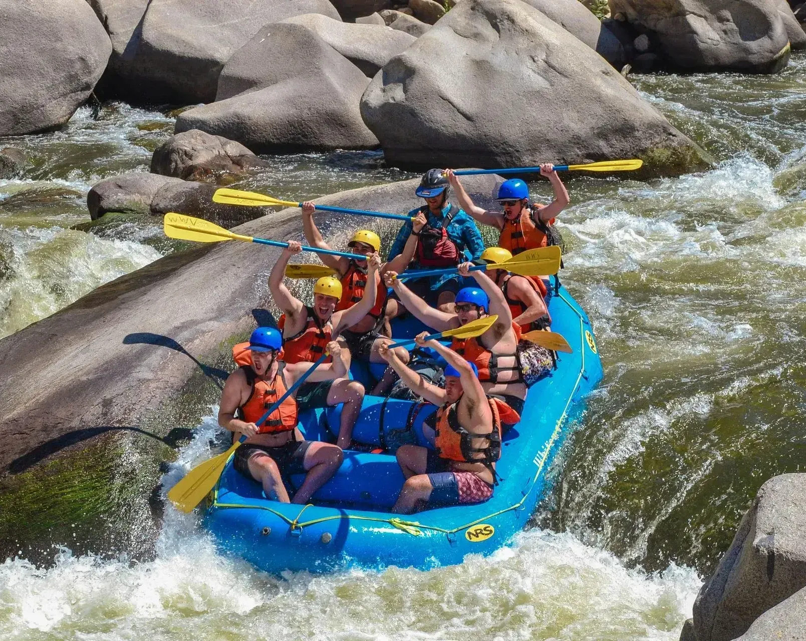 A group of people are rafting down a river.