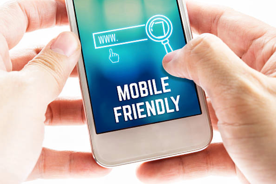 a phone in persons hands and it says mobile-friendly