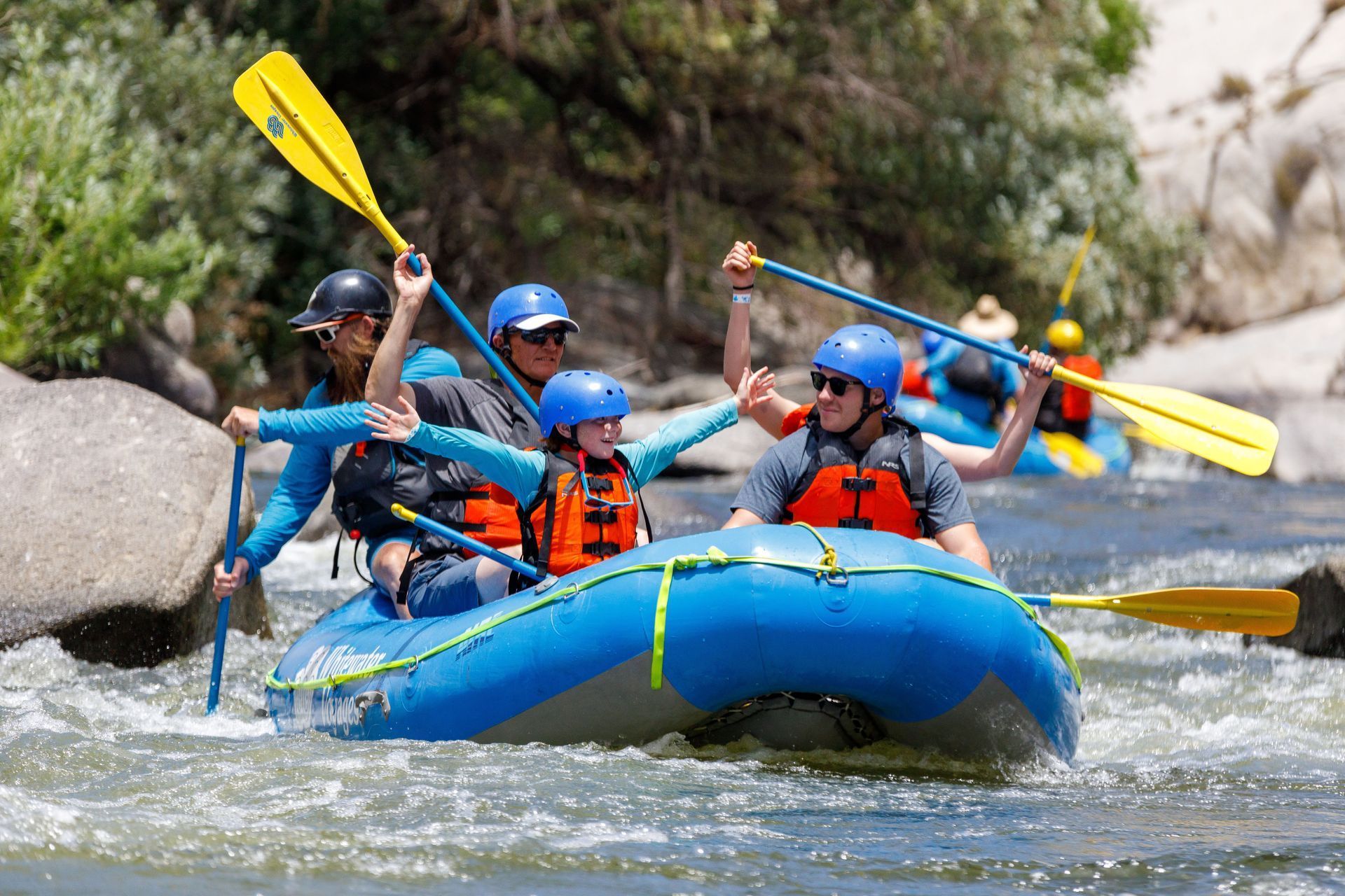 A group of people are rafting down a river.