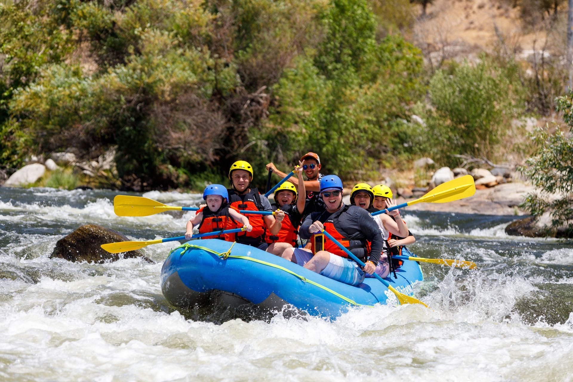 A group of people are rafting down a river.