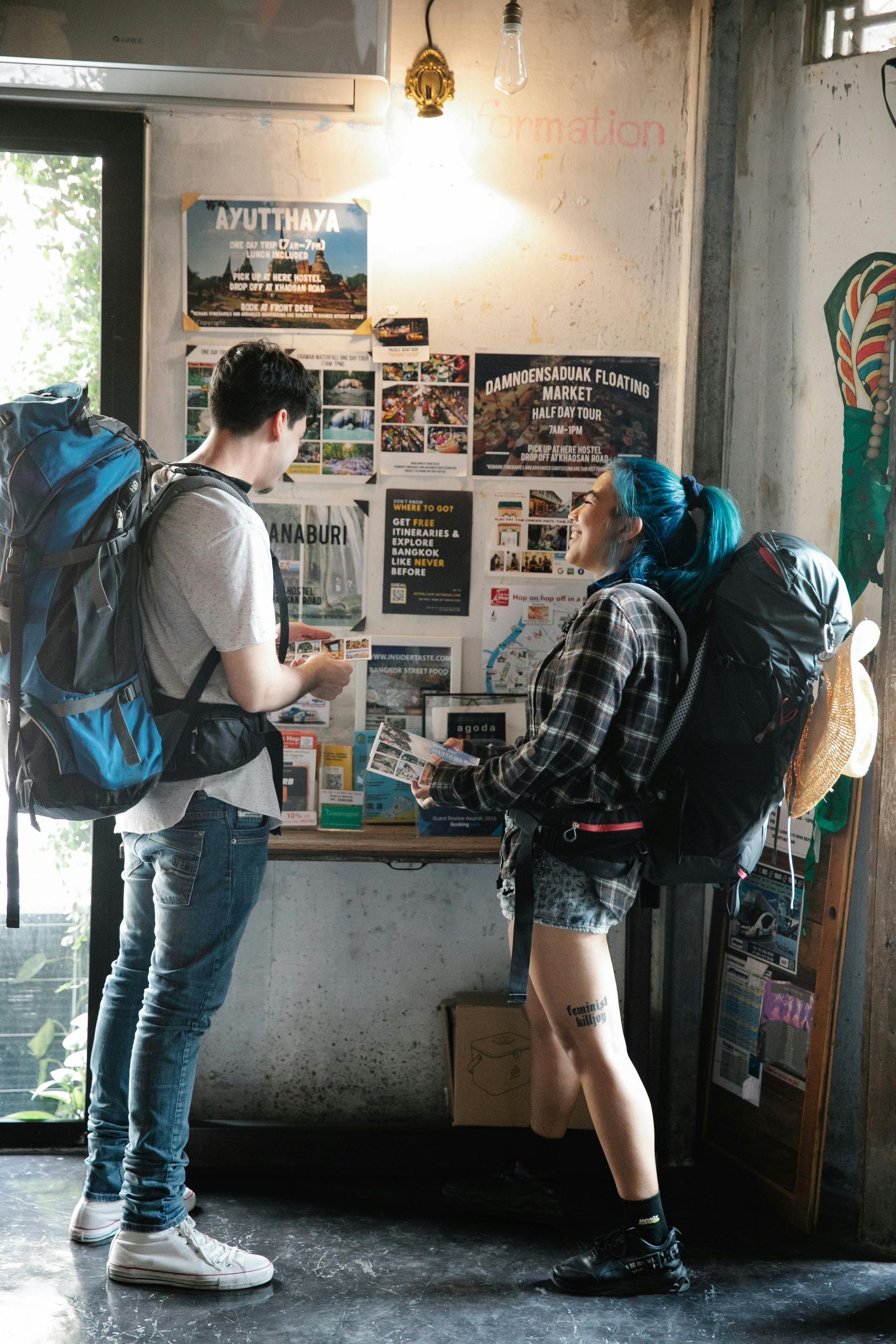 two people looking at a travel brochure