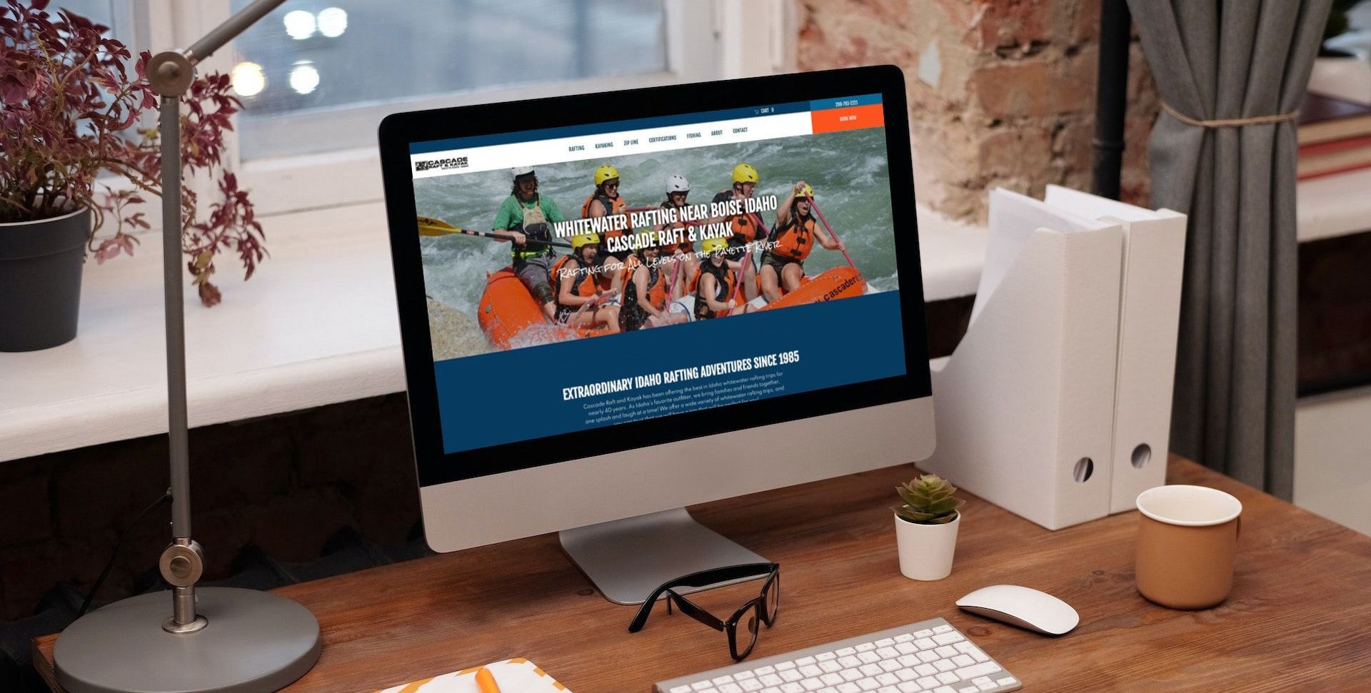 a computer screen displays a website for whitewater rafting