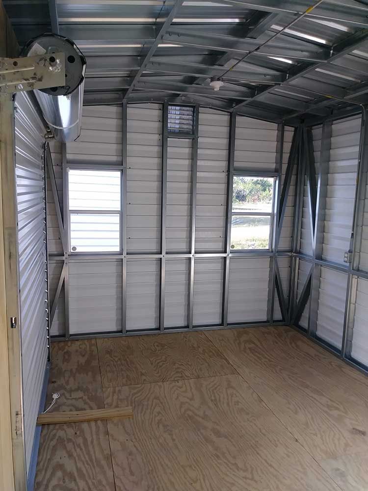 An empty room with a wooden floor and white walls.