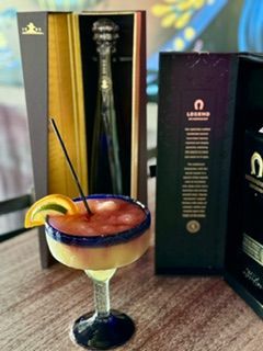 Margarita cocktail with tequila bottle in its presentation box.