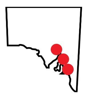 A black and white map with three red dots on it.