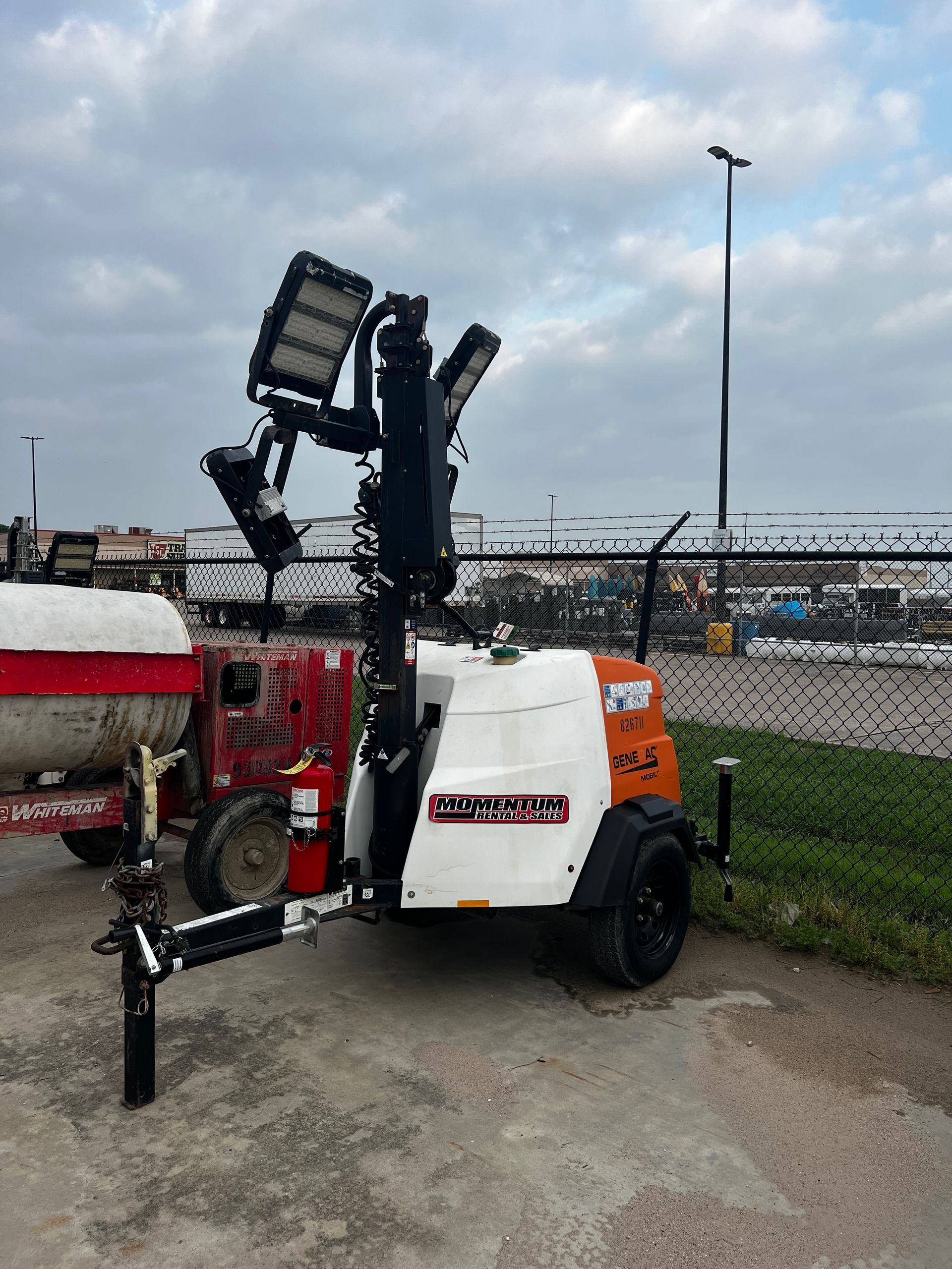 A couple of trailers with lights on them on a white background.