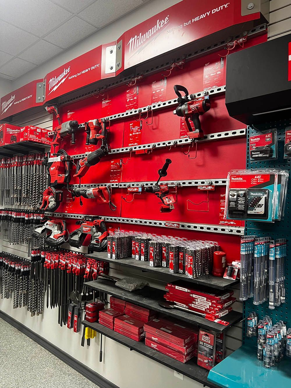 A wall filled with lots of tools in a store.