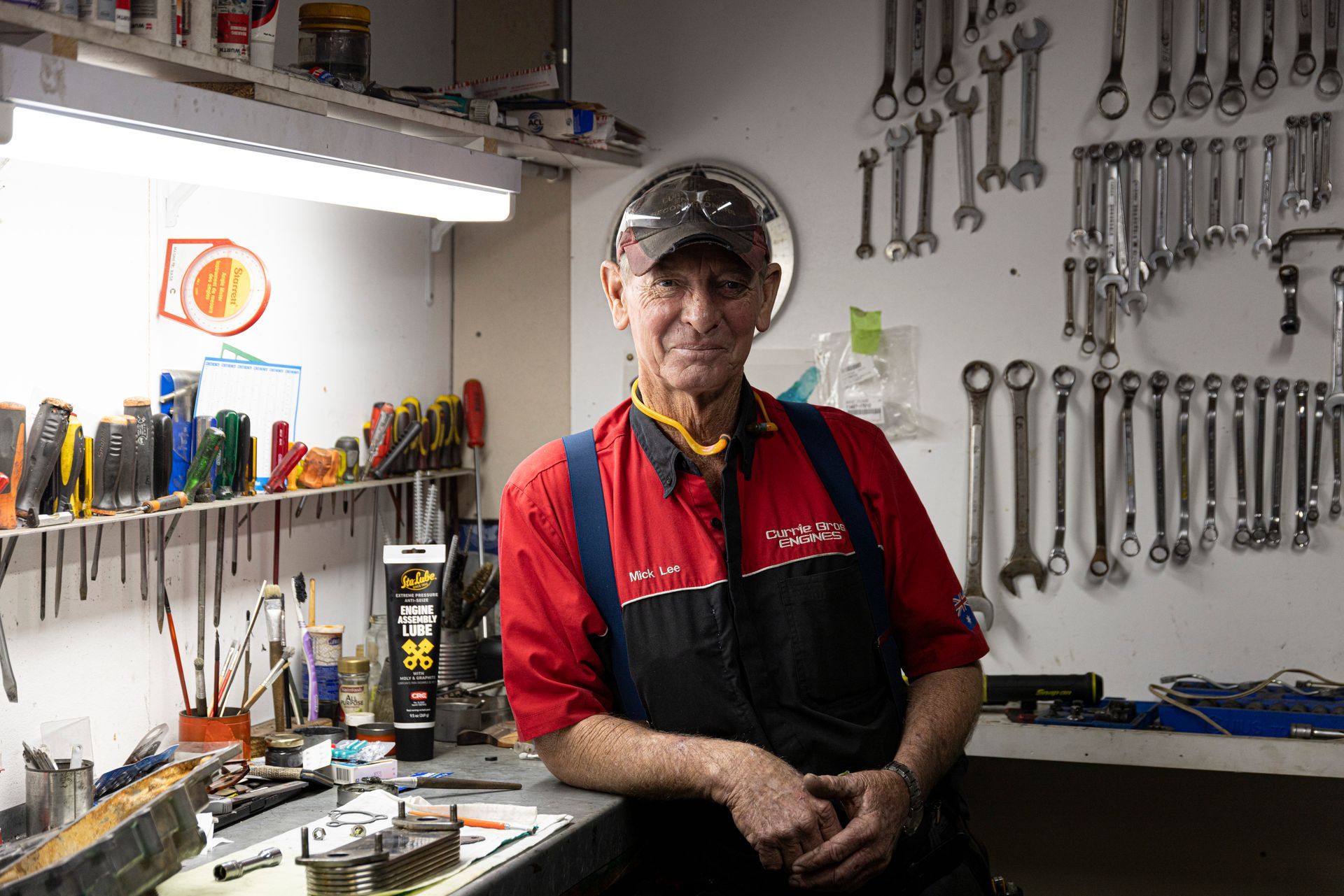 Mechanics Holding Old Clutch Disk — Currie Bros Engine Reconditioners in Taree, NSW