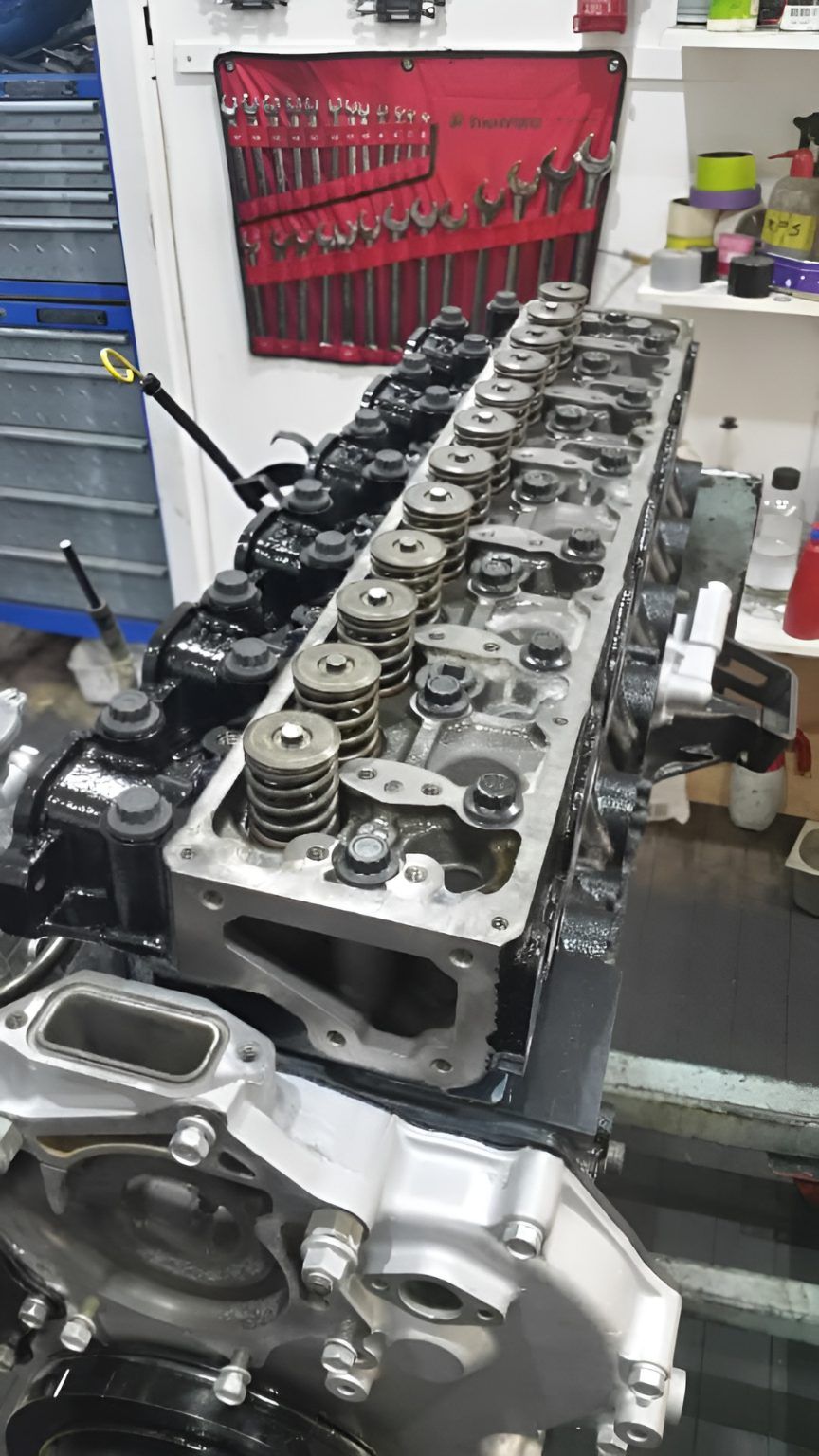 A Close Up of a Car Engine in a Garage — Currie Bros Engine Reconditioners in Forster, NSW