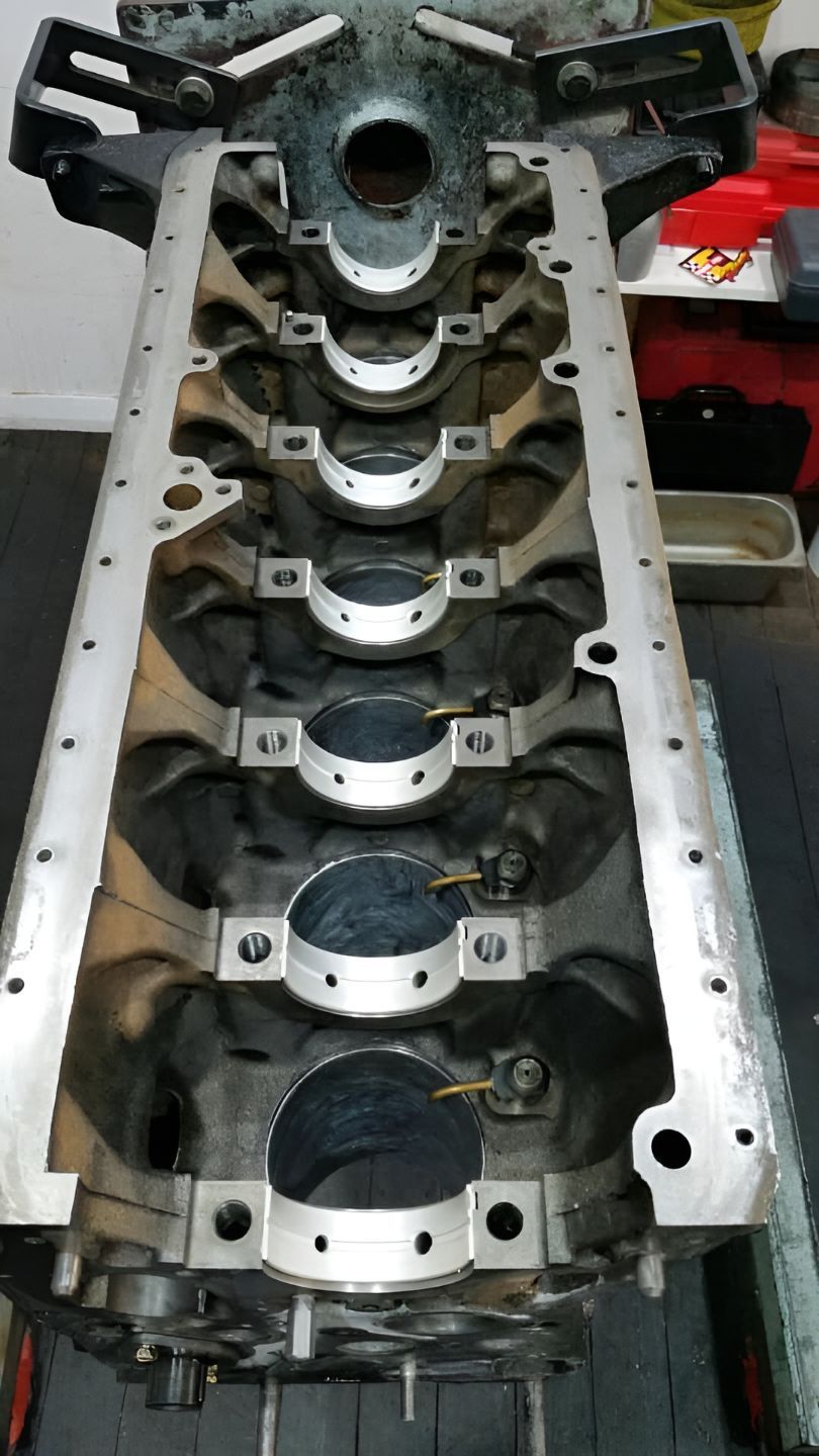 A Block of a Car Engine is Sitting on a Table — Currie Bros Engine Reconditioners in Taree, NSW