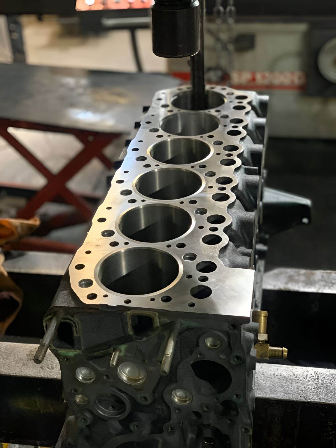 A Cylinder Block is Being Worked on by a Machine — Currie Bros Engine Reconditioners in Wauchope, NSW