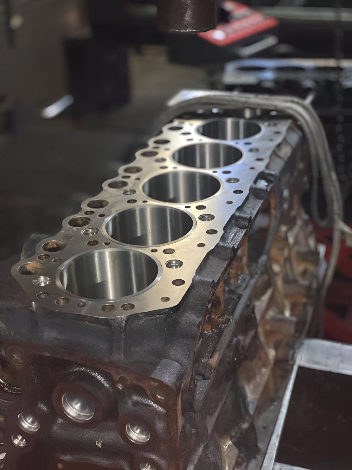 A Close Up of a Cylinder Block With Holes in It — Currie Bros Engine Reconditioners in Gloucester, NSW