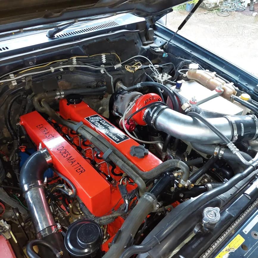 Opened Car Hood Engine View — Currie Bros Engine Reconditioners in Taree, NSW