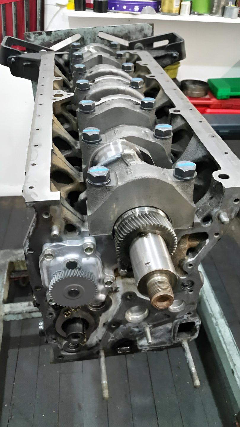 A Close Up of a Crankshaft on a Table in a Garage — Currie Bros Engine Reconditioners in Taree, NSW