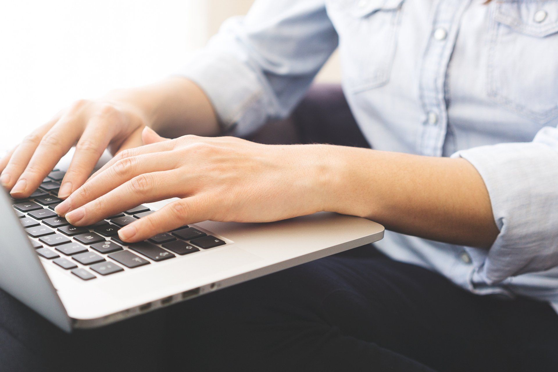 Female Typing on Laptop – Salt Lake City, UT – Hypnoscure LLC