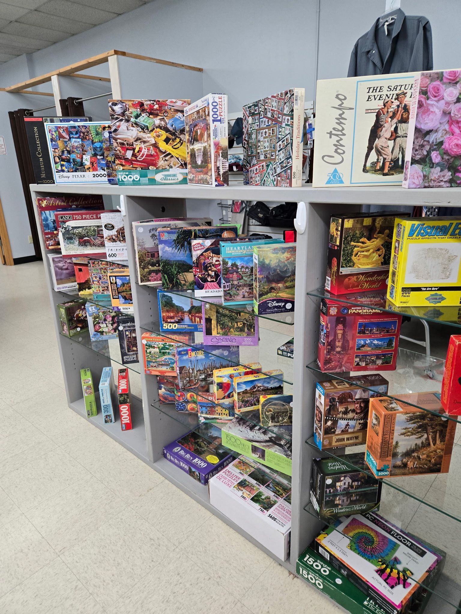 A shelf filled with lots of toys in a store.