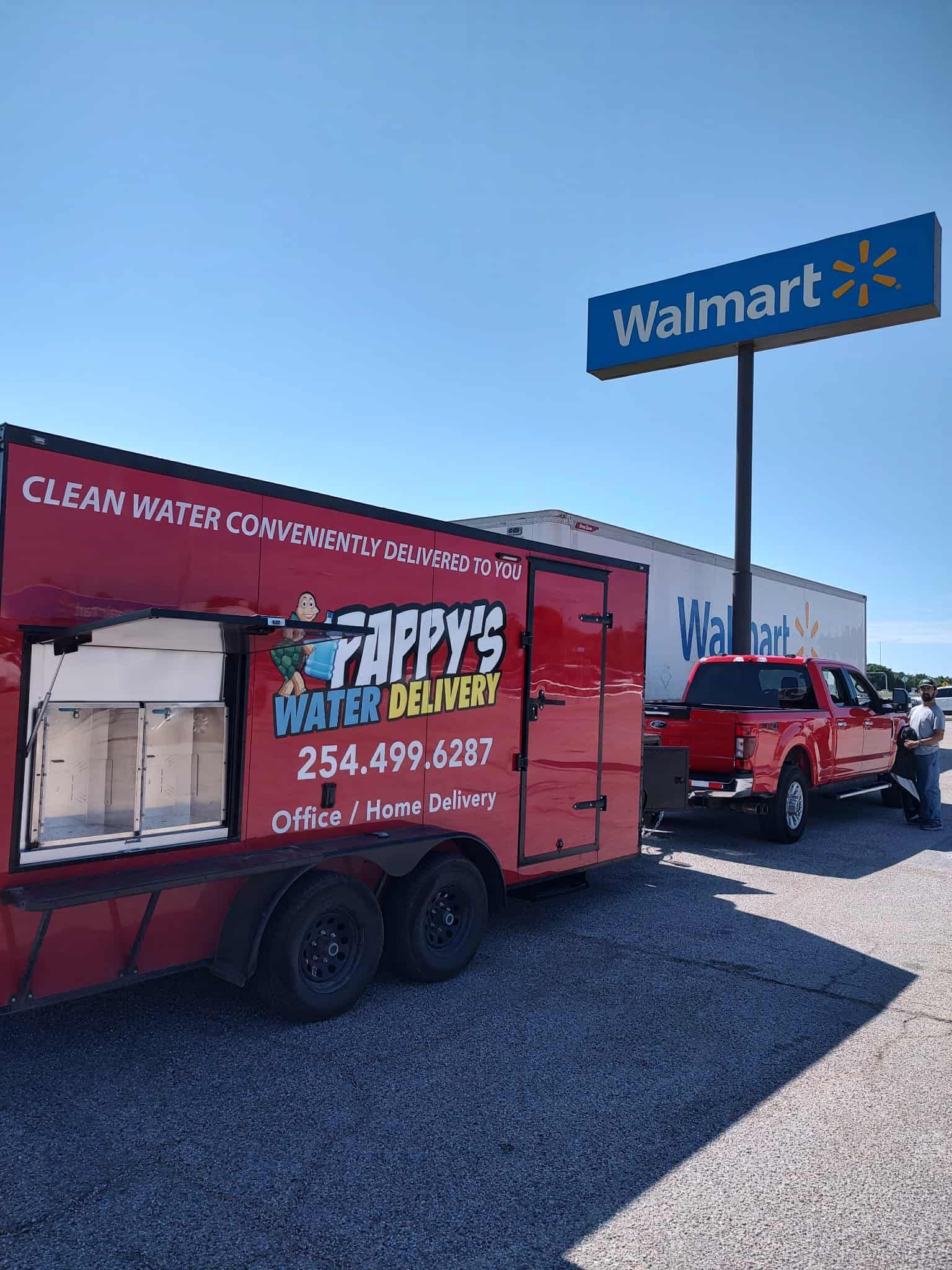 Red truck towing a red trailer with