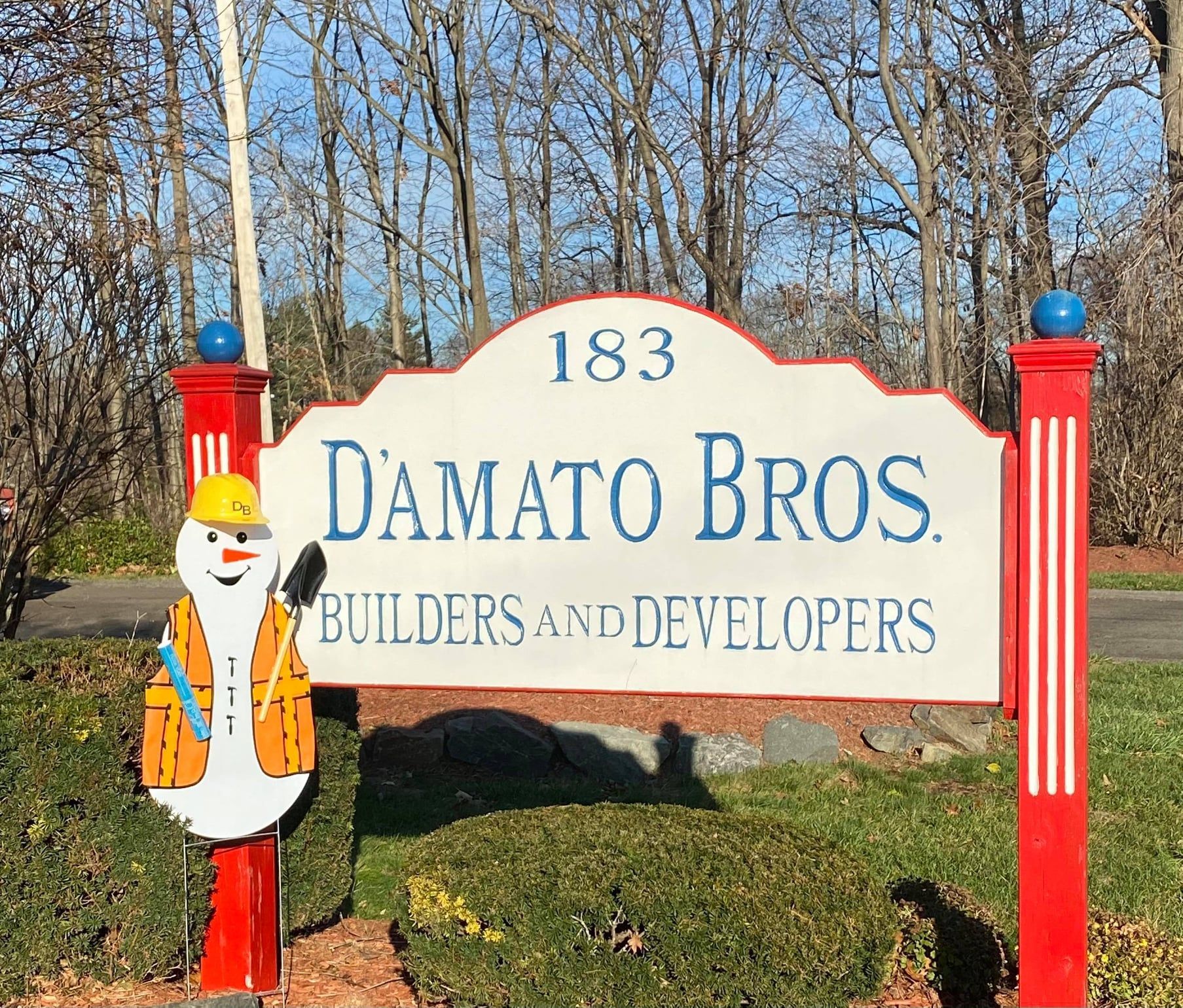 a sign for damato bros builders and developers