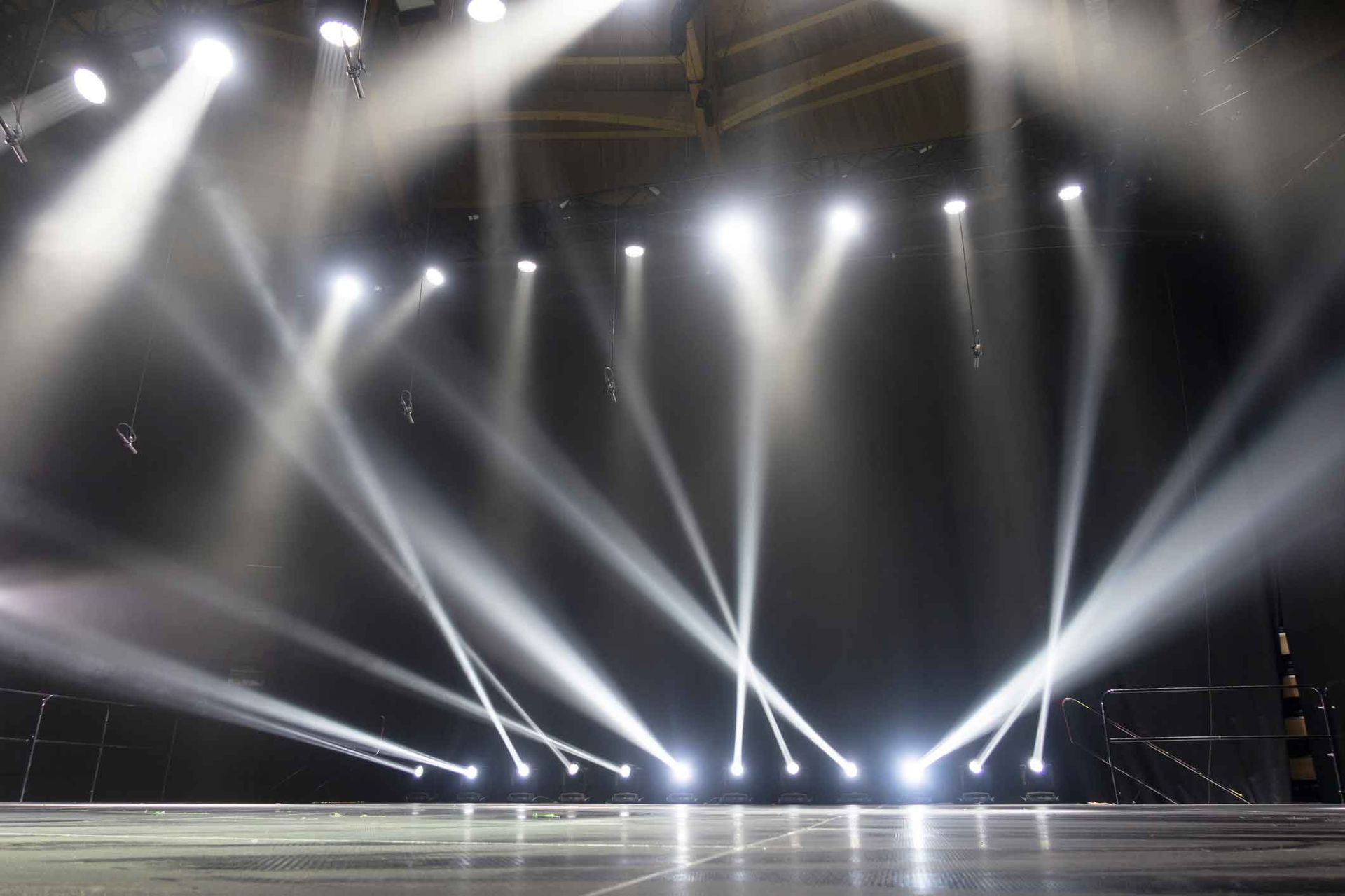 A stage with a lot of lights on it in a dark room.