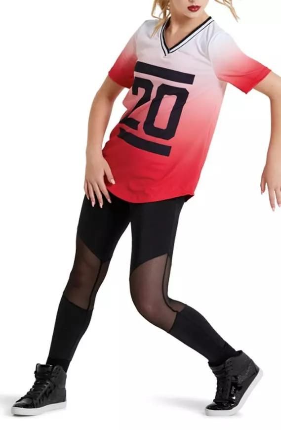 A girl is wearing a red and white shirt with the number 20 on it