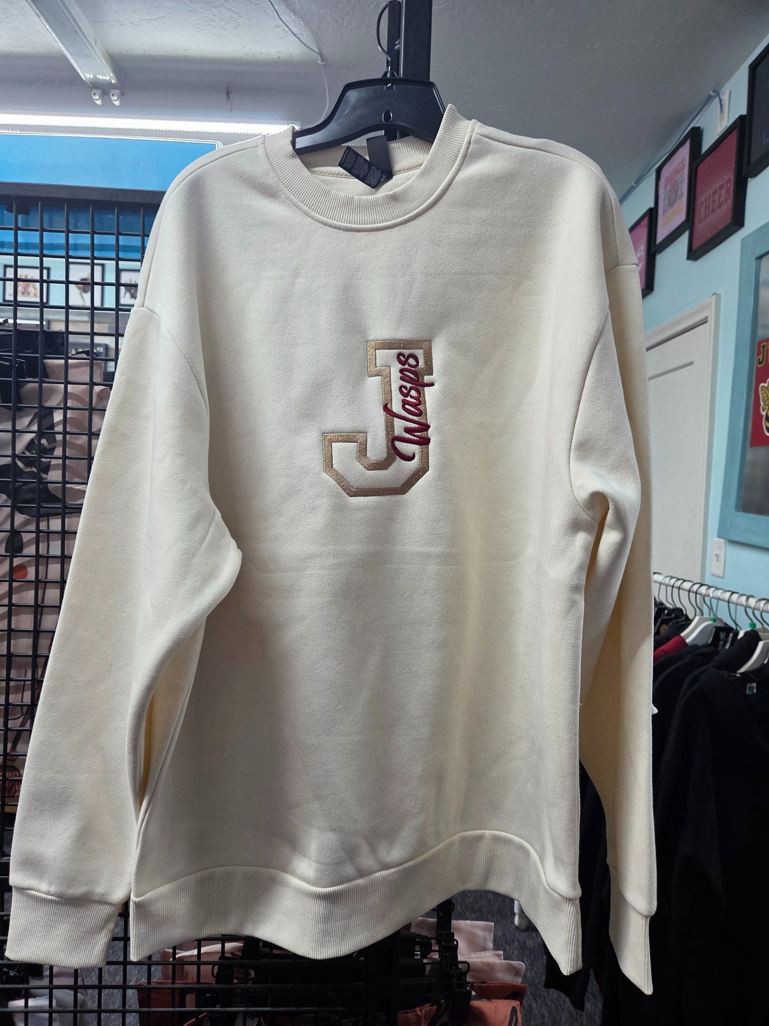 Cream-colored sweatshirt with a beige 