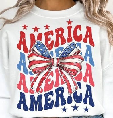 A woman is wearing a white shirt that says america