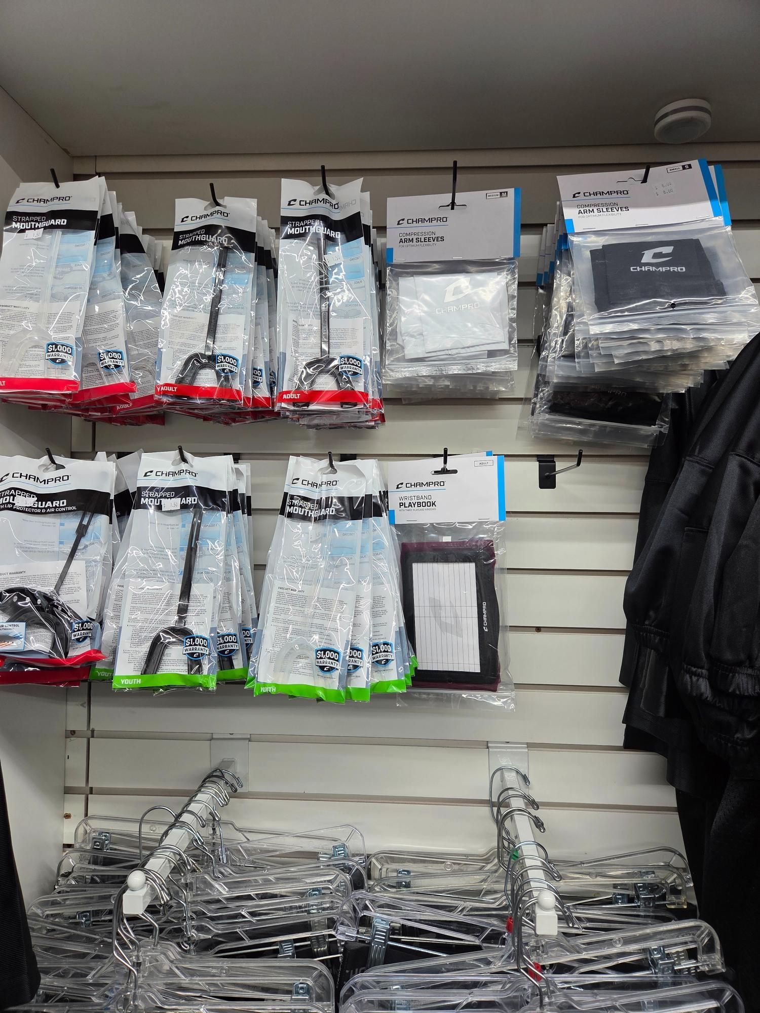 Shelves displaying packaged merchandise: cables and accessories in a store setting.