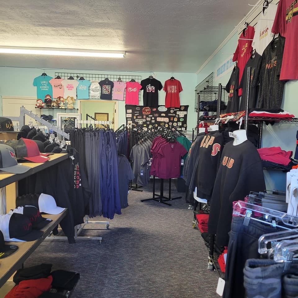 A store filled with lots of shirts and hats including one with the number 29 on it