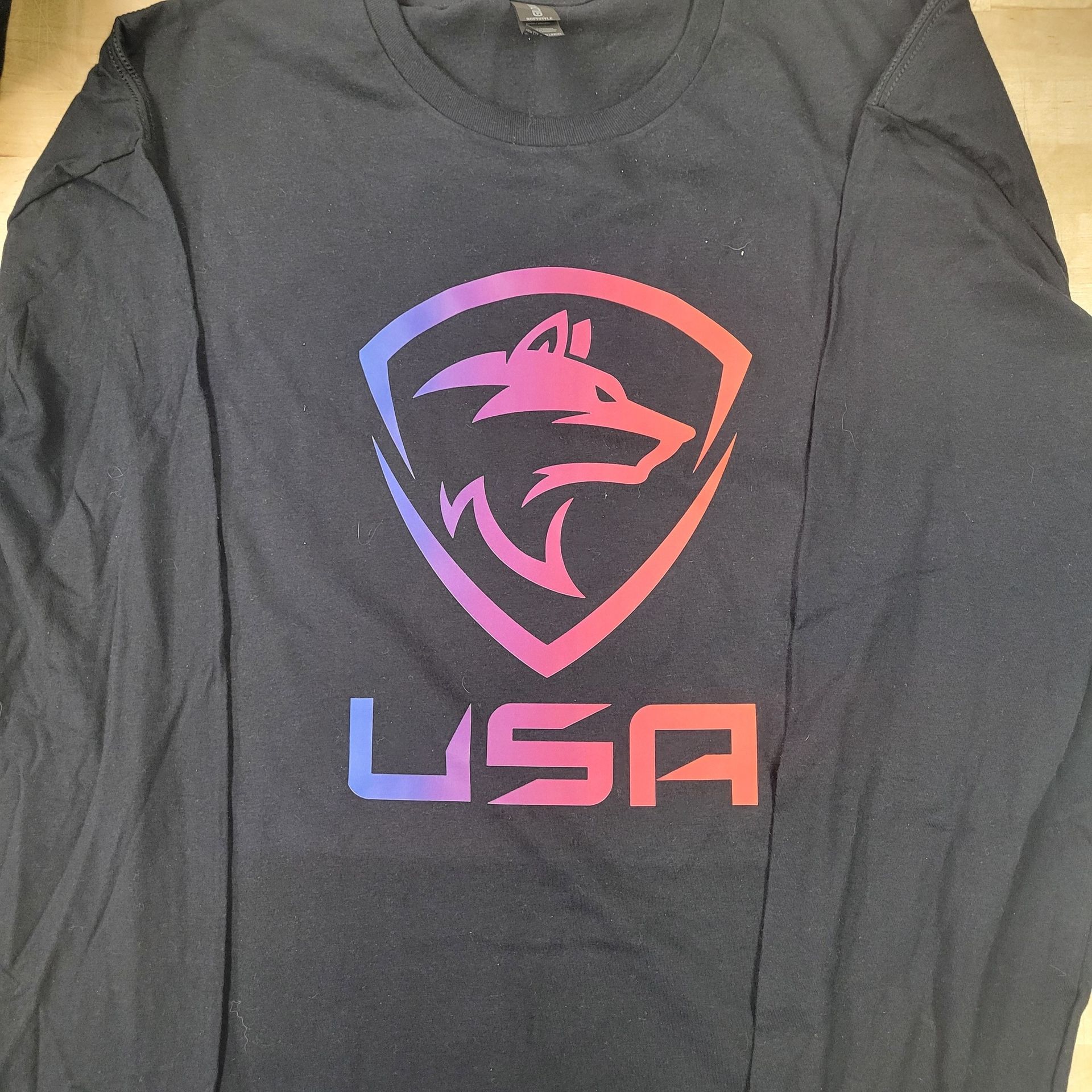 A black shirt with a wolf and the word usa on it