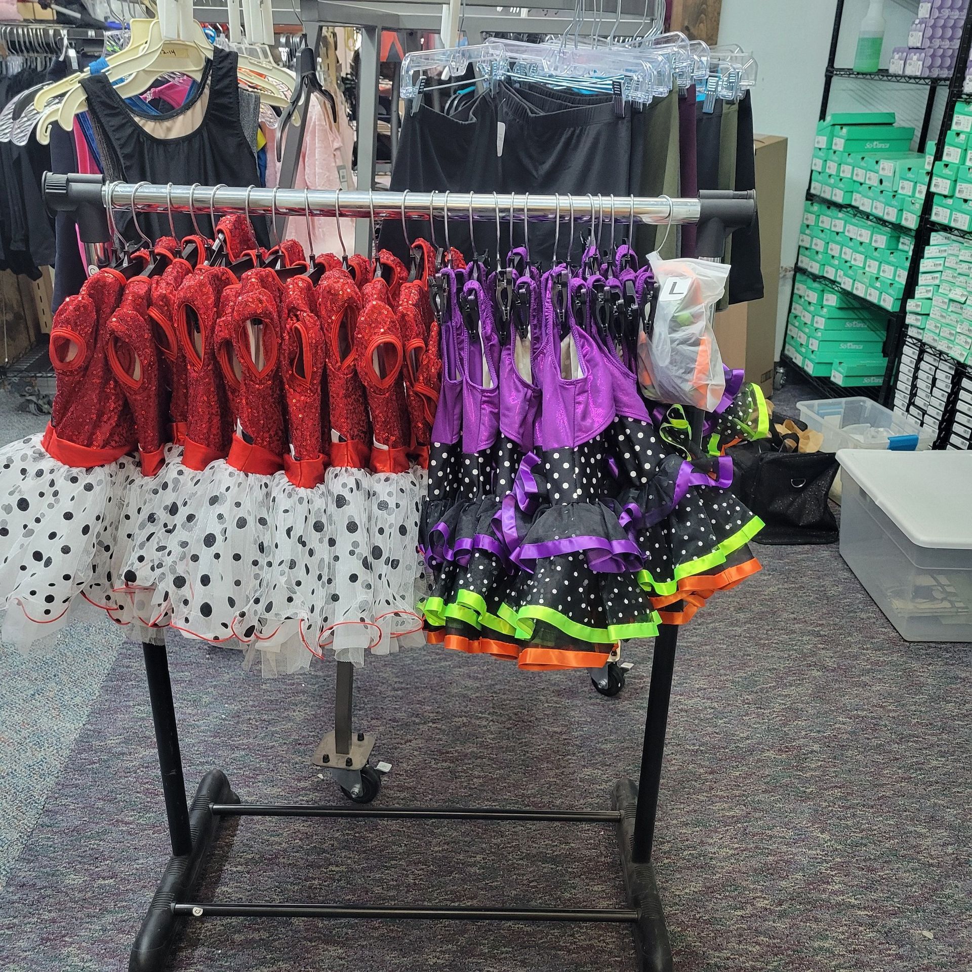 A rack with a bunch of skirts hanging on it