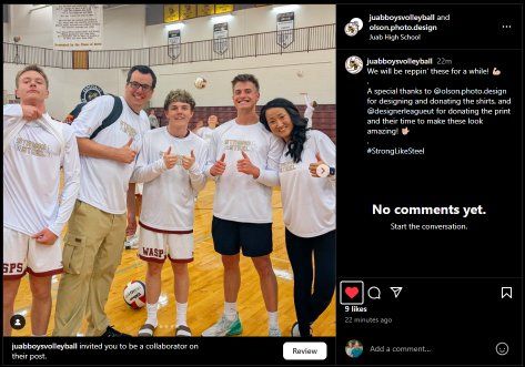 Group of people posing for a photo in a gym; smiling. One person giving a thumbs up. Basketball court.