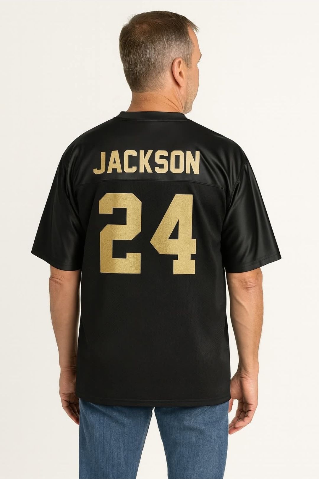 Man wearing a black football jersey with 
