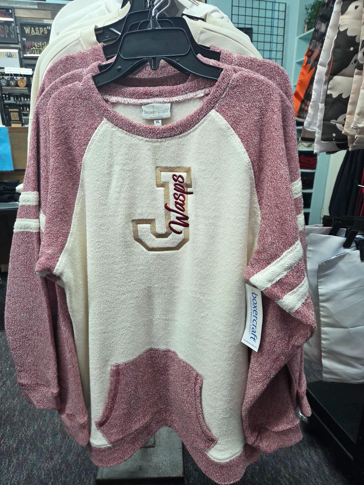 Cream and maroon sweatshirt with a kangaroo pocket and 