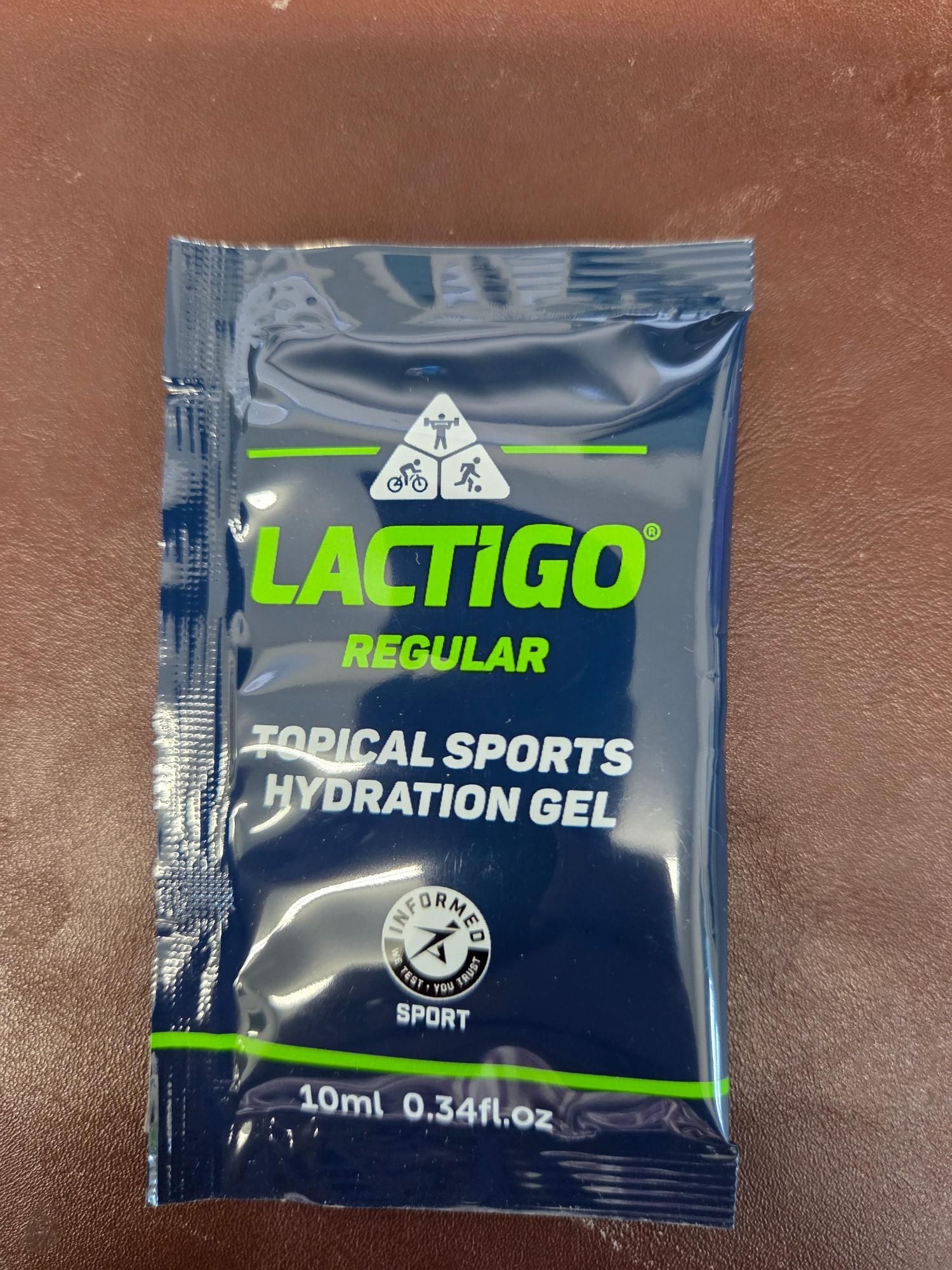 Dark blue Lactigo sports hydration gel packet with green accents.