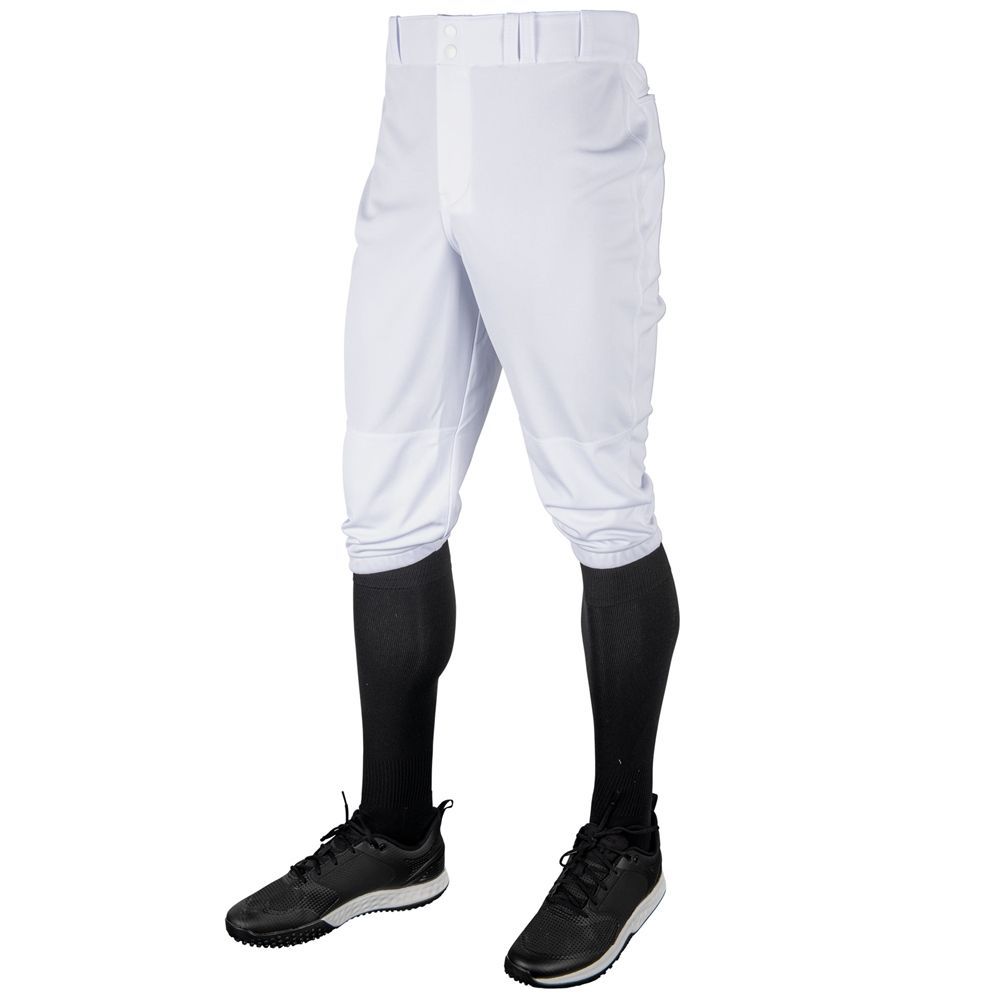 White baseball pants with black socks and shoes.