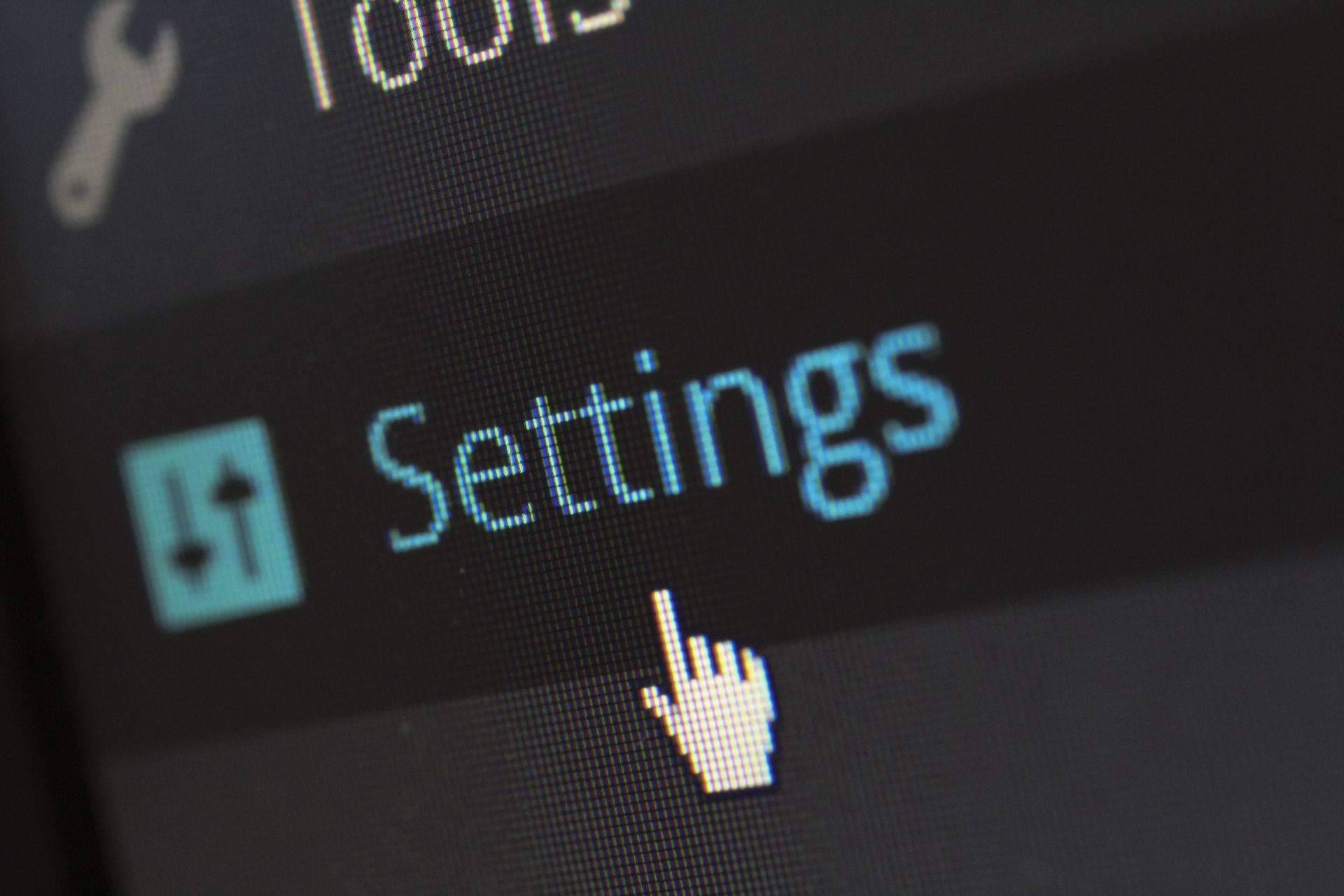 Cursor hovering over a blue “Settings” menu item on a dark interface.