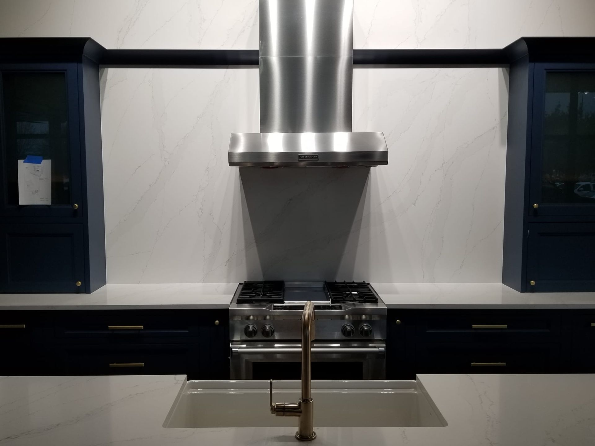 A kitchen with stainless steel appliances and a sink