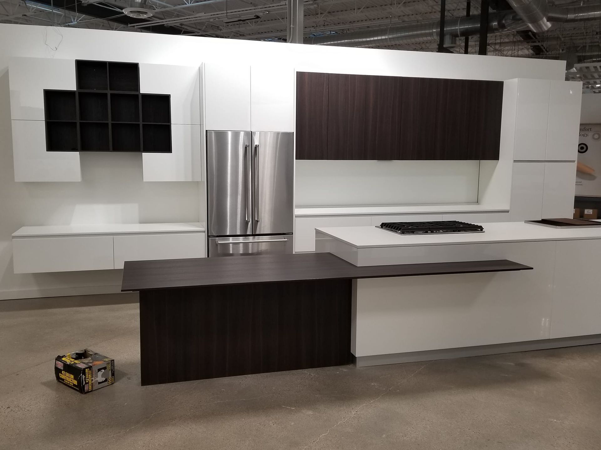 A kitchen with stainless steel appliances and wooden cabinets