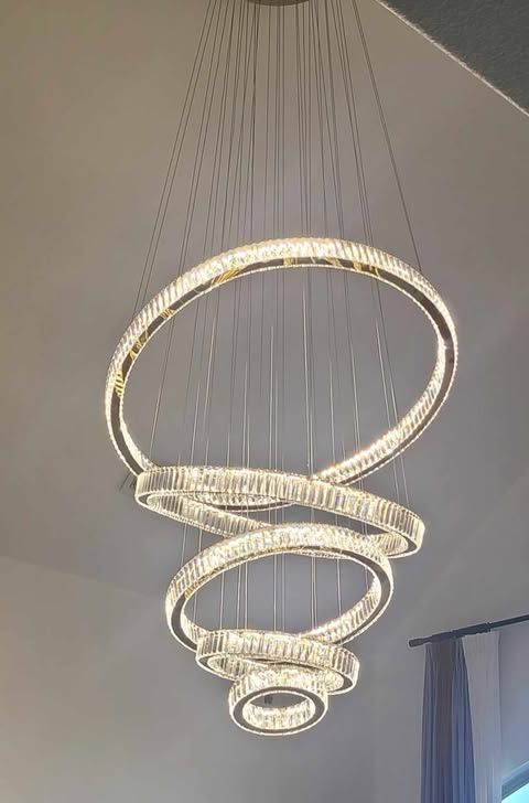 A large chandelier is hanging from the ceiling in a room.